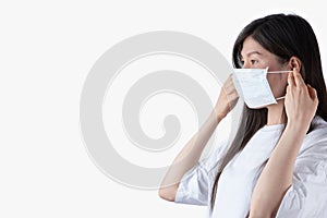 Asian girl wearing protective mask from covid-19