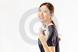 Asian girl wearing sportwear holding drinking water looking camera