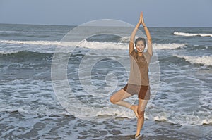 Asian girl yoga beach sunset lifestyle