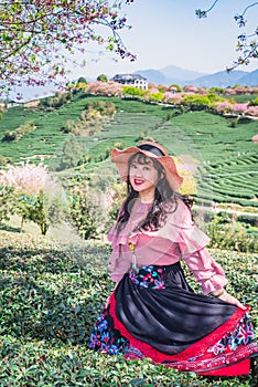 Asian girls in the tea garden in spring