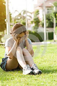 Asian glasses woman sitting and having headache.