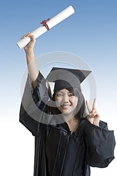 Asian Graduate student holding her diploma