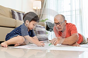 Asian Grandfather and Grandson coloring with Crayons