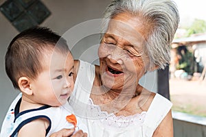 Asian Grandmother with baby