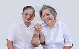 Asian grandmother and grandmather smile and show thump up in happy emotion