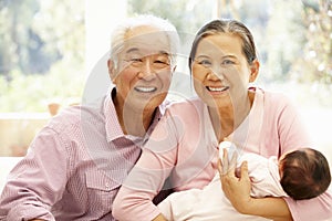 Asian grandparents with baby