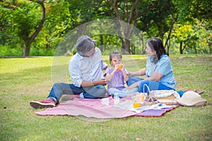 Asian Grandparents spend time in holiday with granddaughter by p