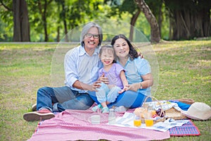Asian Grandparents spend time in holiday with granddaughter by p