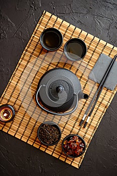 Asian green tea set on bamboo mat