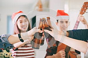 Asian group of friends having party with alcoholic beer drinks a