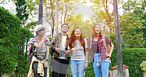 Asian Group of young people with friends backpacks walking together and happy friends are taking photo and selfie ,Relax time on