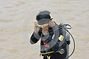 Asian guy he is in a dive series. And prepare before going down