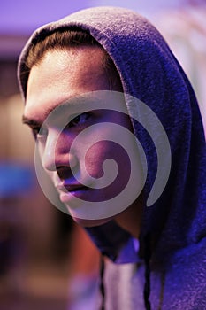 Asian hacker in hood doing cyberattack