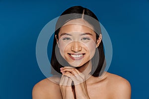 Asian half-naked woman smiling and looking at camera
