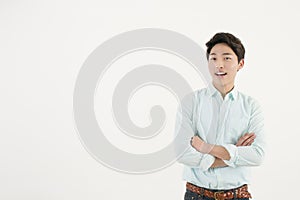Asian handsome male student with his arms crossed
