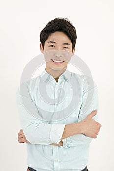 Asian handsome male student with his arms crossed