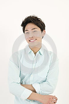 Asian handsome male student with his arms crossed