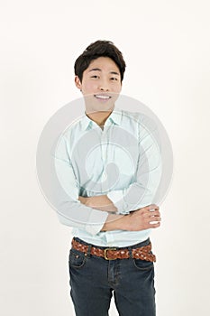 Asian handsome male student with his arms crossed