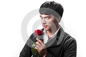 Asian handsome man hold the red rose with love