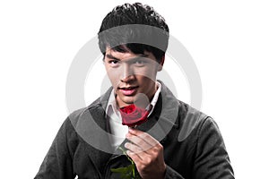 Asian handsome man hold the red rose with love