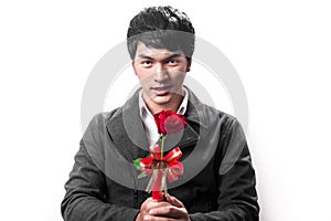 Asian handsome man hold the red rose with love