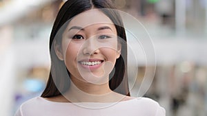 Asian headshot happy optimistic millennial girl 20s brunette woman with natural make-up businesswoman wife girlfriend