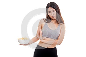 Asian healthy girl hate potato chips, junk food.