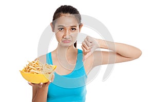 Asian healthy girl thumbs down with french fries