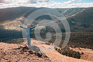 Asian hiker woman enjoys climbing on high mountain in national Park. Beautiful view of the valley