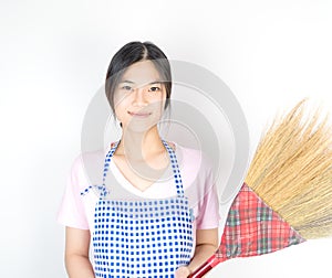 Asian houswife maid is holding broom
