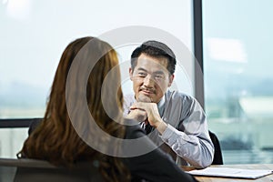 Asian hr manager interviewing business woman