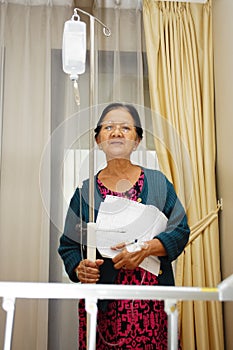 Asian ill old woman portrait in hospital ward