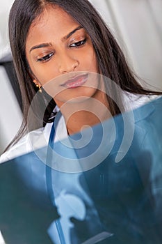 Asian Indian Female Woman Hospital Doctor Looking at X Ray