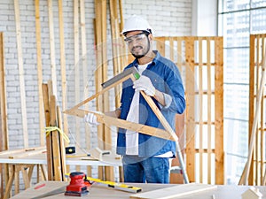 Asian Indian professional male and female engineer architect foreman labor worker lover couple wear safety goggles standing