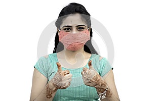 Asian / Indian woman wearing face mask against Pollution, Coronavirus or COVID-19. Isolated over white background