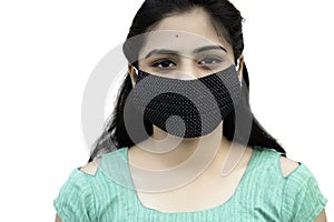 Asian / Indian woman wearing face mask against Pollution, Coronavirus or COVID-19. Isolated over white background