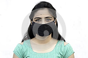 Asian / Indian woman wearing face mask against Pollution, Coronavirus or COVID-19. Isolated over white background