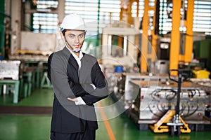 Asian industrial manager in factory warehouse