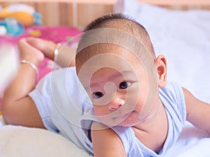 Asian infant lie on the stomach.