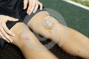 Asian with injured kneecaps