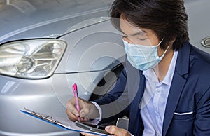 Asian Insurance Agent or Insurance Agency Wear Mask Write Car Crash Report in Zoom View