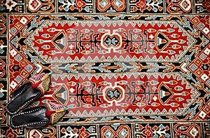 Asian interior. Carpet and slippers