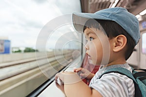 Asian Japanese boy in commuter train