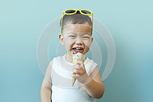 Asian Japanese little boy eating ice cream