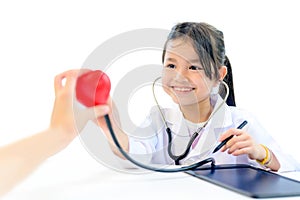 Asian kid as doctor and health care concept. Wellness and Self-care. Children dream job when grow up