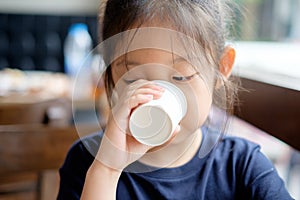 Asian Kid Drinking Water from Paper Cup