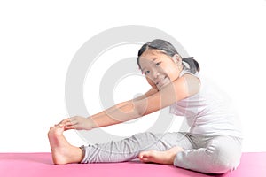 Asian kid exercise on yoga mat isolated