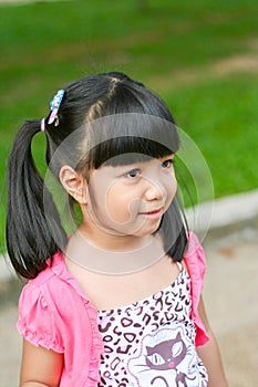 Asian kid girl looking at something