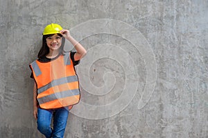 Asian Kid girl wearing reflective shirts and a hat yellow. To learning and enhance development, little architect