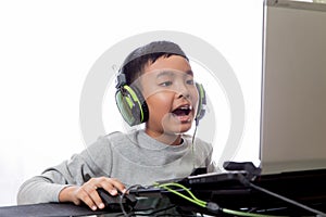 Asian kid play computer games and talking with friend